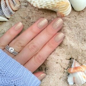 Color Street | Sands of Time, a warm mocha shade with golden glitters